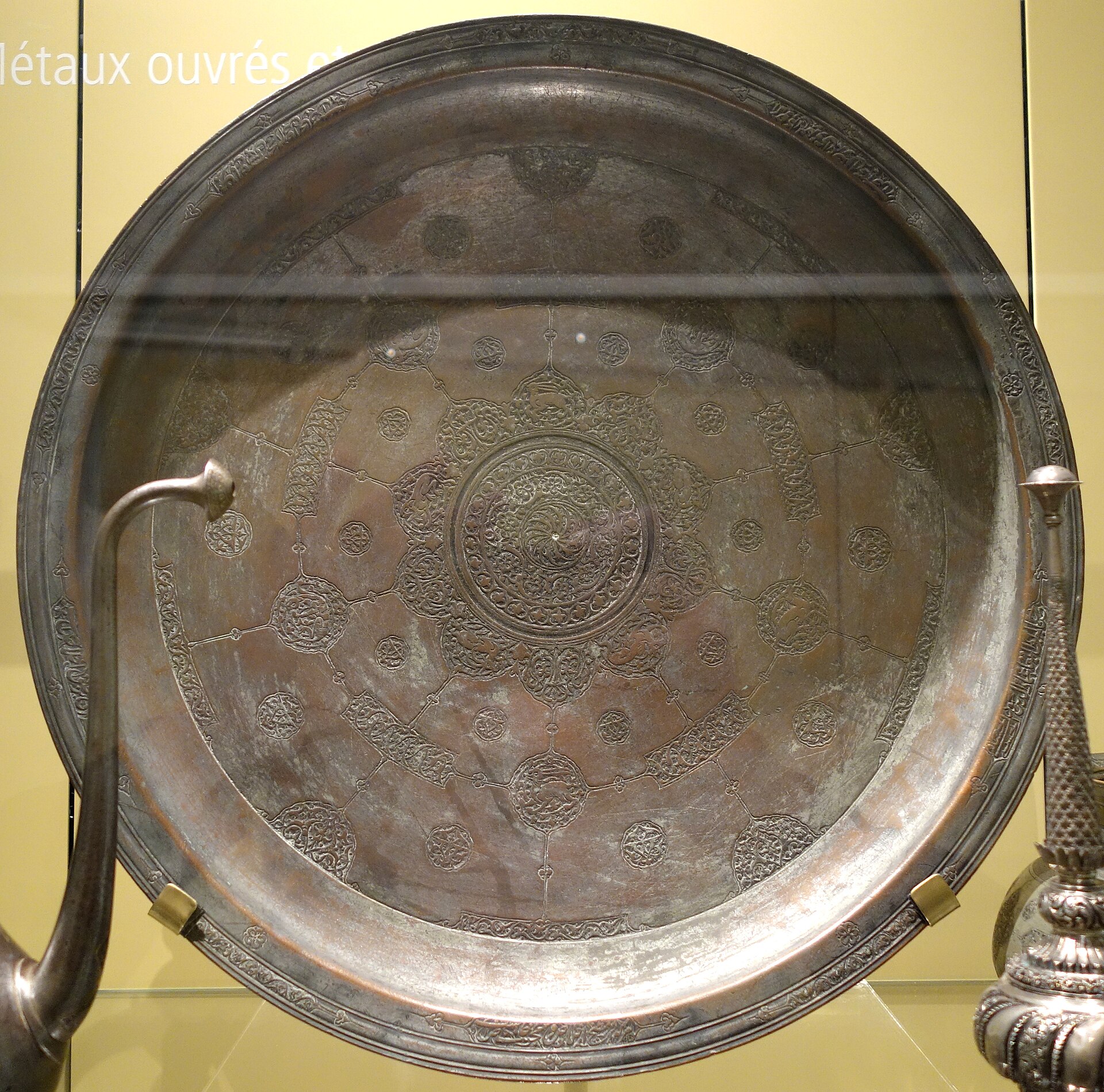 Tabaq tray with a Persian poem, Iran, late 16th century, engraved and tinned copper