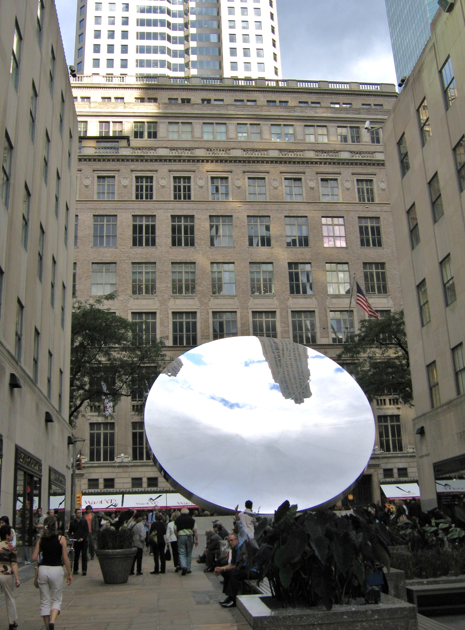 Sky Mirror by Anish Kapoor, polished stainless steel sculpture at Rockefeller Center