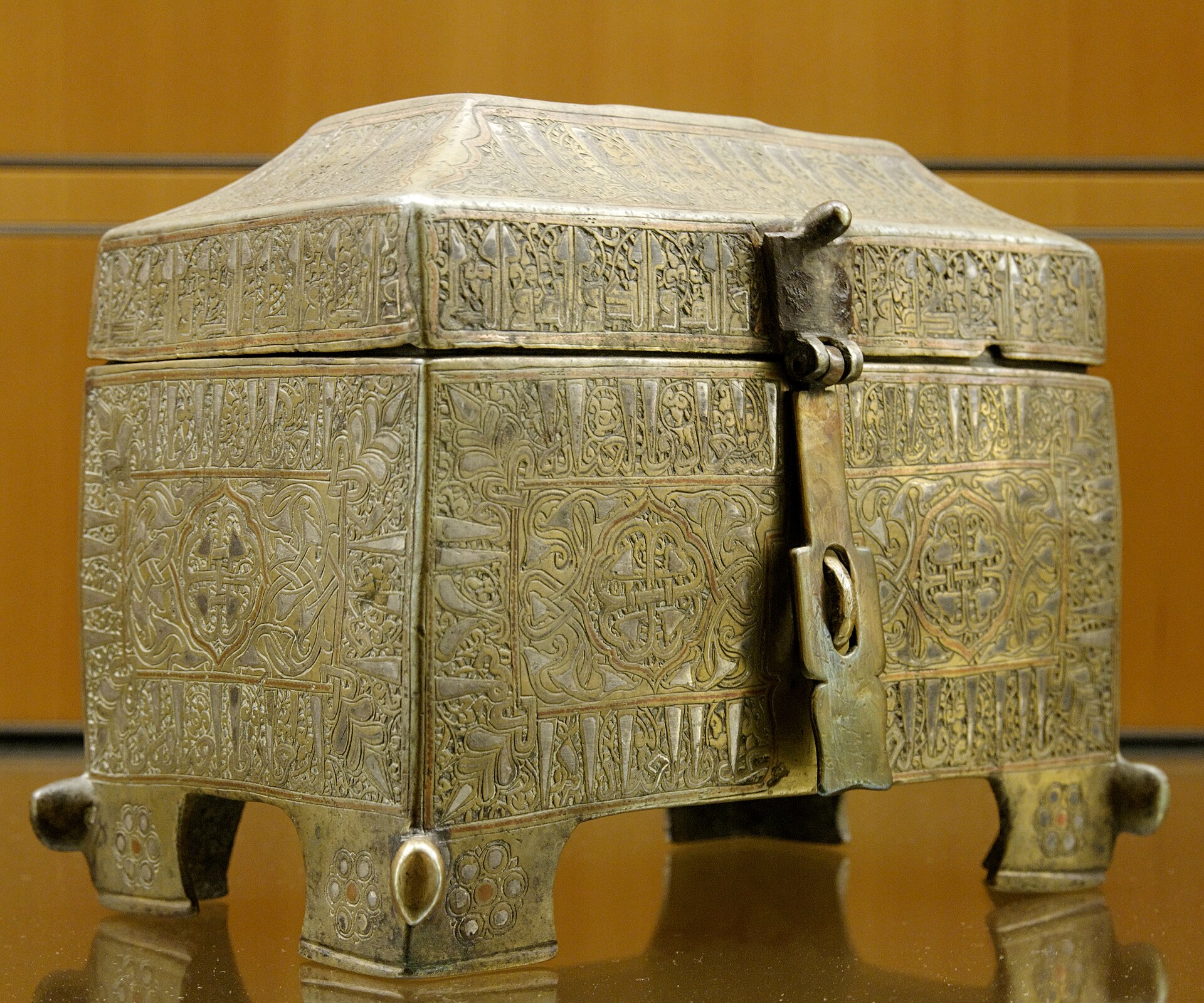 Casket with epigraphic decoration. Bronze damaskeened with silver, late 12th century–early 13th century. From Khorasan, Iran.