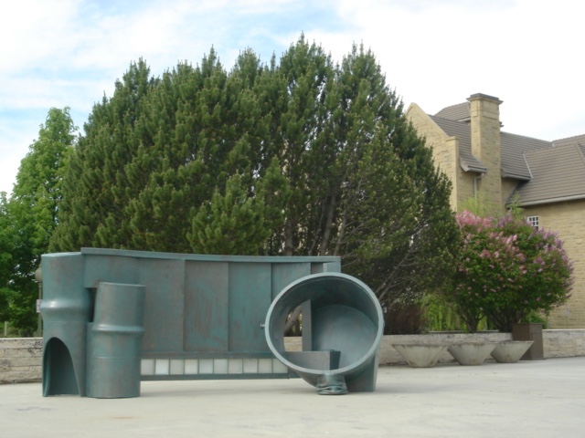 A painted steel and glass sculpture, exhibited at the Royal Alberta Museum in 2006.