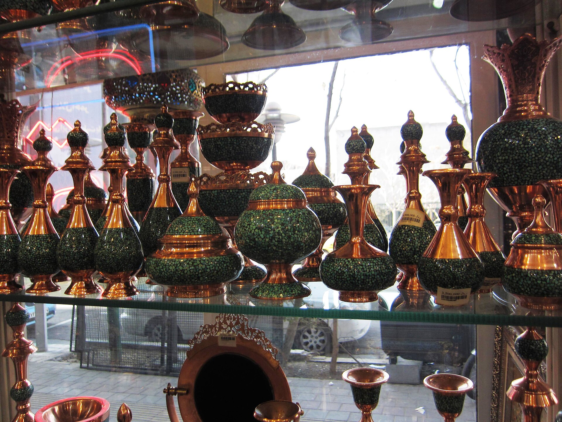 Firoozeh koob handicrafts from Iran. They are made by hammering small pieces of turquoise on a copper, brass or silver container.