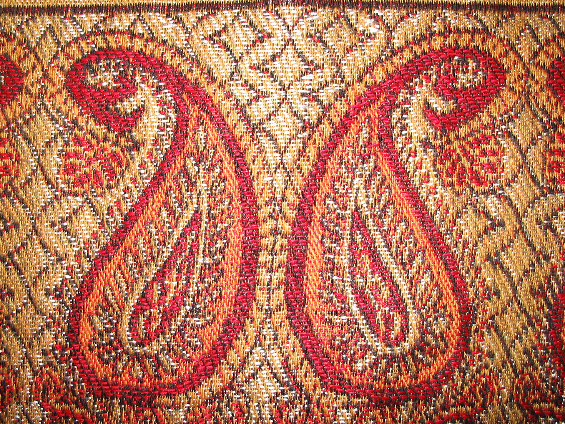 Boteh a persian motif on textile looking like an almond.