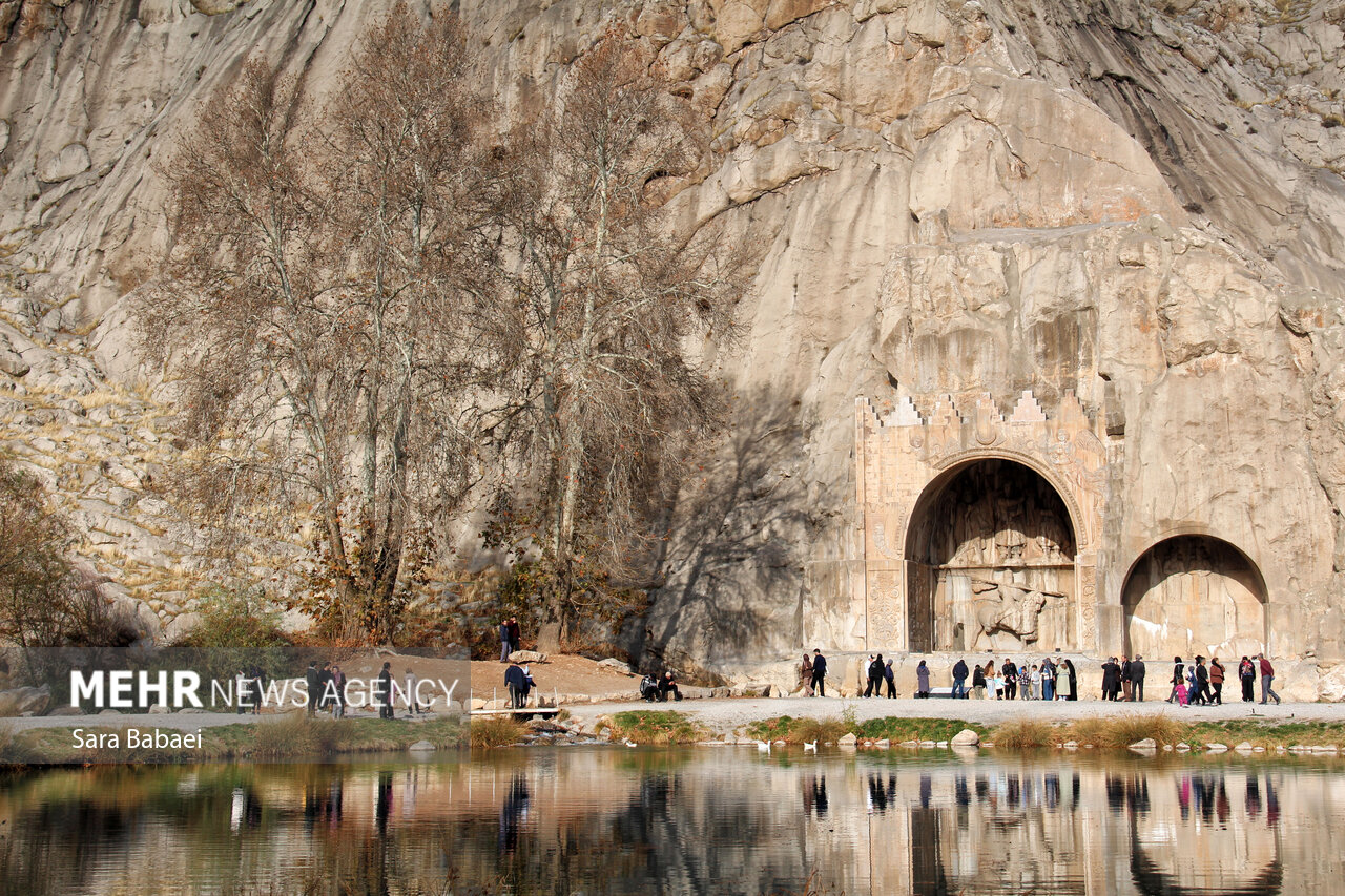Translation of original description: In the last days of autumn, the historical site of Taq-e-Bostan has taken on a different appearance, where the warm colors of the last days of autumn along with ancient petroglyphs create a pleasant confluence of the nature of the season and the enduring history of Kermanshah in the picture frame.