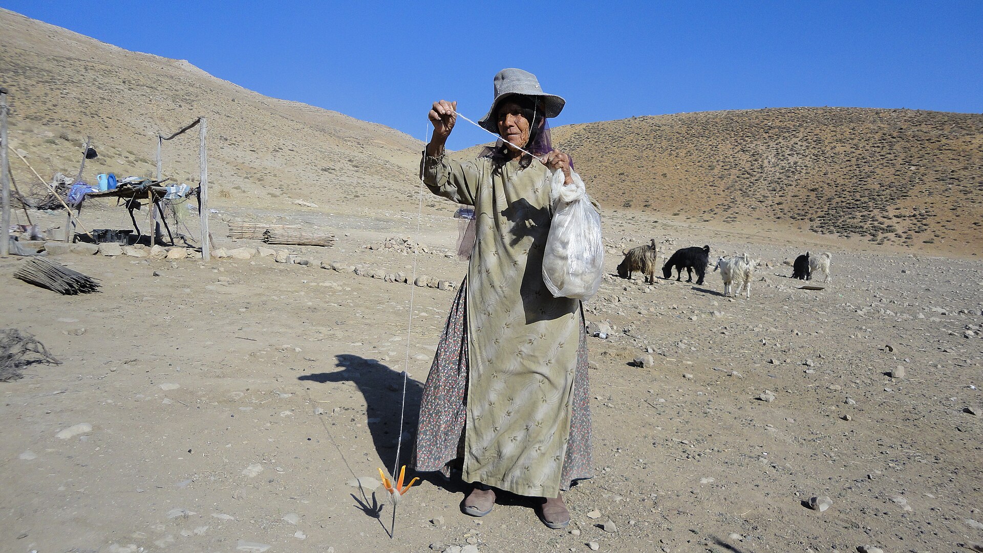 As nomads try to meet their needs through nature, this Qashqai Turkish lady is spinning sheep's wool to make yarn.
