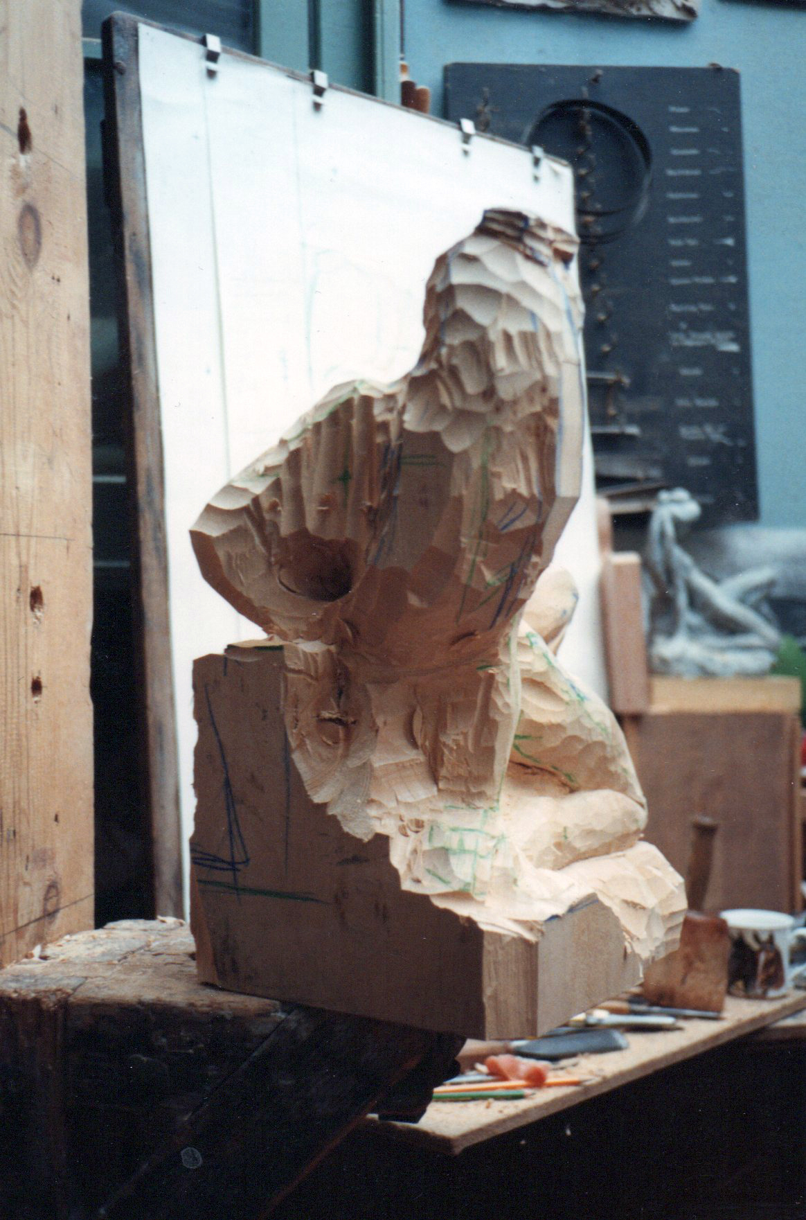 Denis Parsons ' interpretation of Amphitrite from Greek Mythology, carved in Lime wood, height 1'8". The various expressions expressed in the face was always important to Denis who gained a reputation for the graceful form of his figurative work. Blocking in the figure in the workshop.