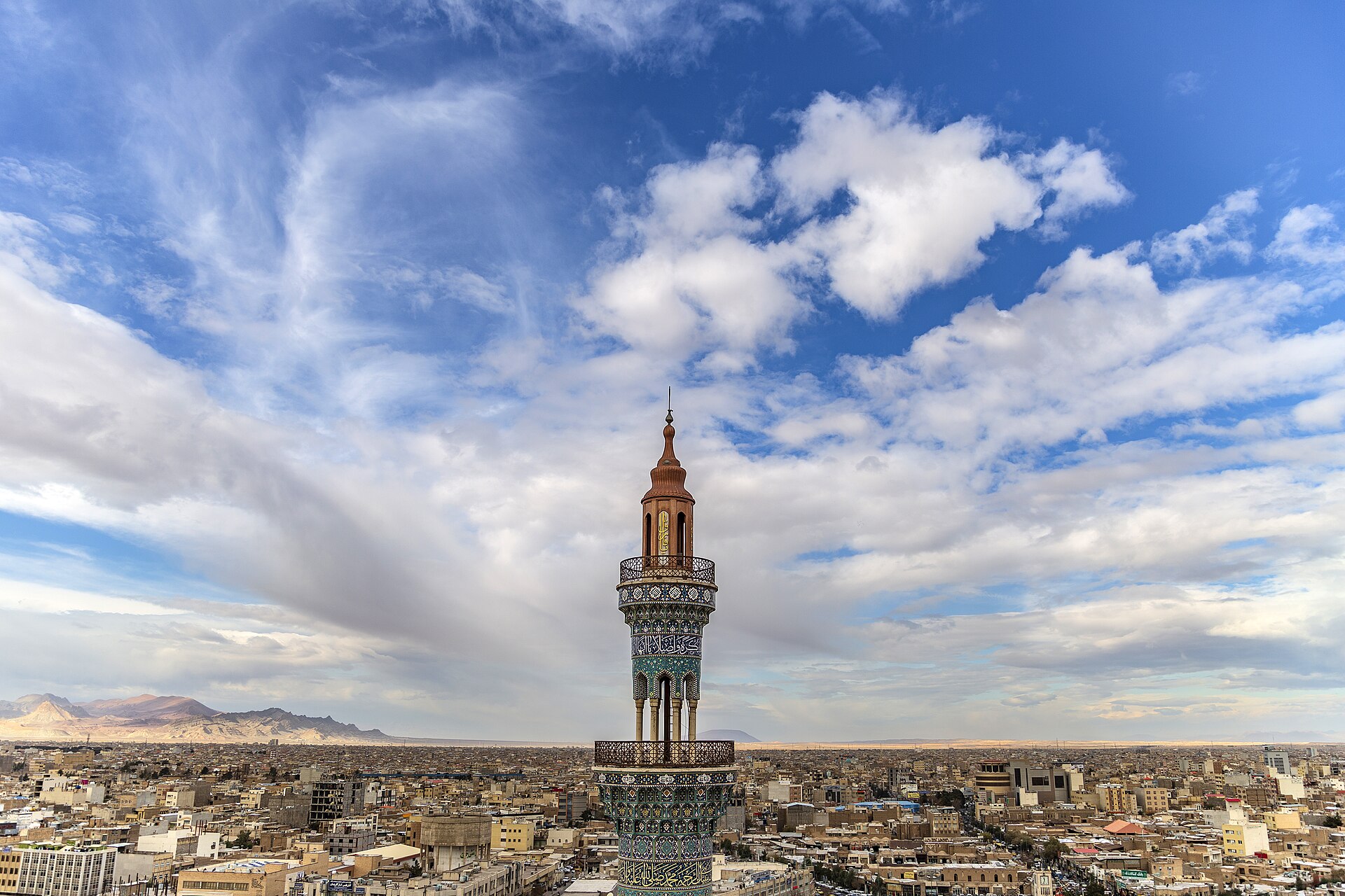 Qom is located beside the desert at 140 km south of Tehran with the height of 930 m above the sea level in an arid region. It enjoys a desert and semi-desert climate. Summer is warm and arid and winter is nearly cold in this city. Qom consists of 5 parts as "Jafarabda", "Khalajestan", "Salafchegan", "Kahak", "Markazi", one city and 9 rural districts. This city is the 8th populous city after Tehran, Mashhad, Isfahan, Tabriz, Karaj, Shiraz, Ahvaz and second religious city after Mashhad and also one of the main centers of Silk Carpet, Sweets and Sohan production in Iran and all around the world located among Iran transportation roads which connect the industrial cities to Tehran, on one hand, and link the southern provinces and cities of Iran to the northern ones, on the other hand. Qom, one of the most significant desert towns, is of the main poles of developing pilgrimage tourism in Iran.