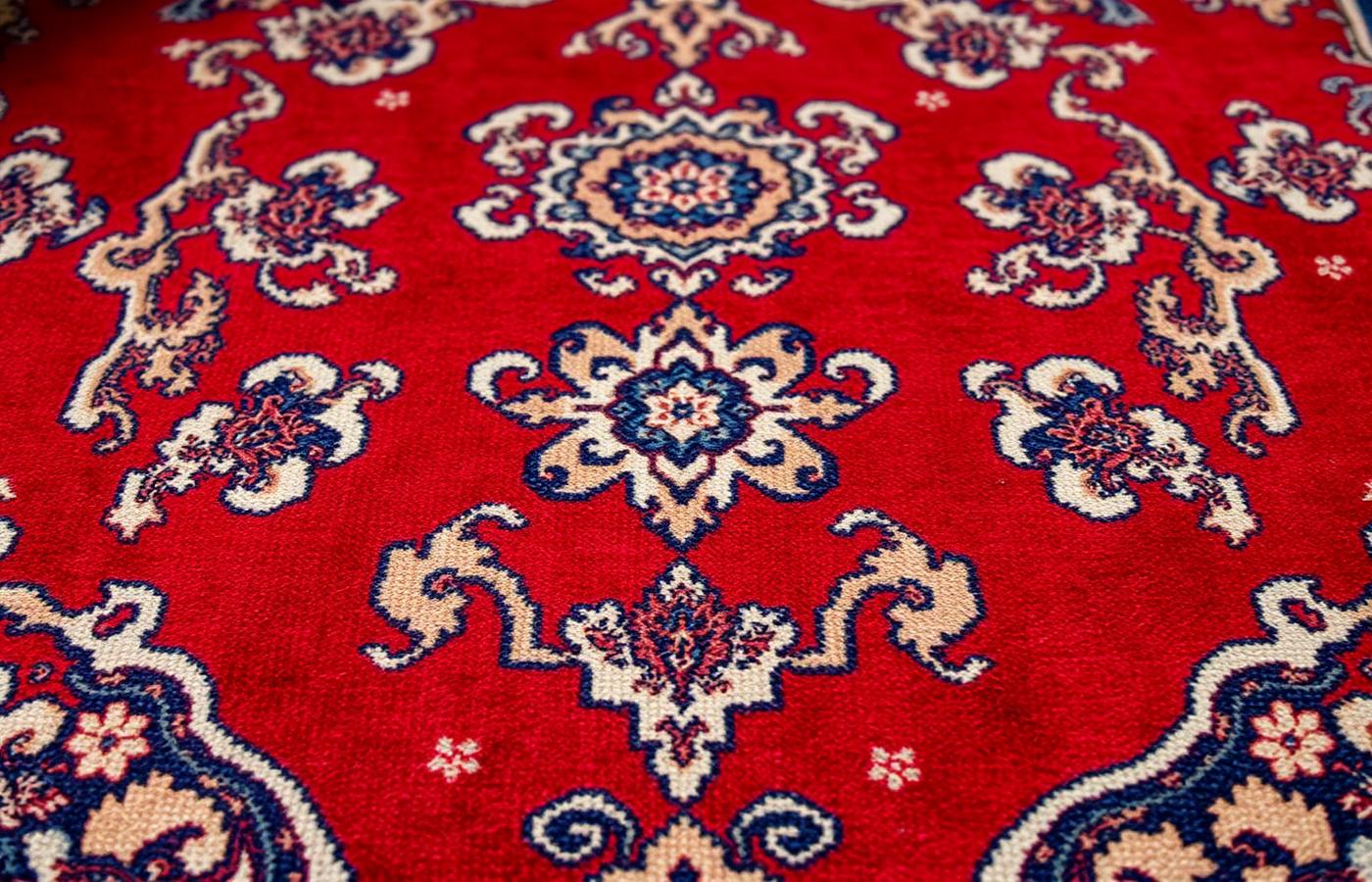 Detail of antique Persian carpet with medallion design
